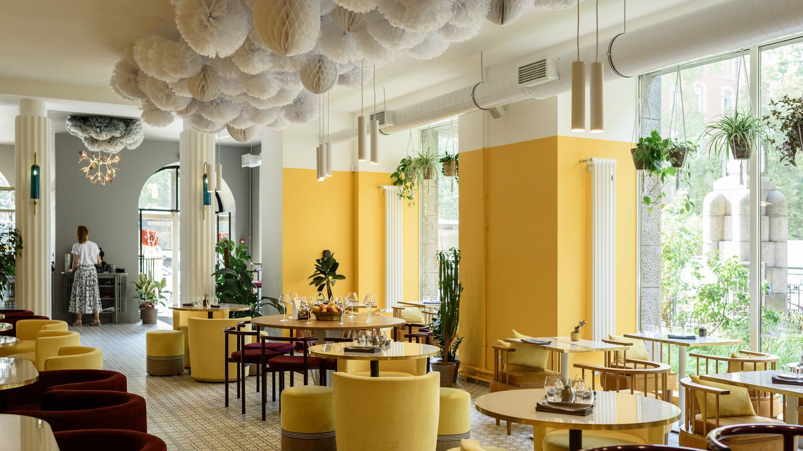 A bright, welcoming South Florida restaurant dining room with set tables