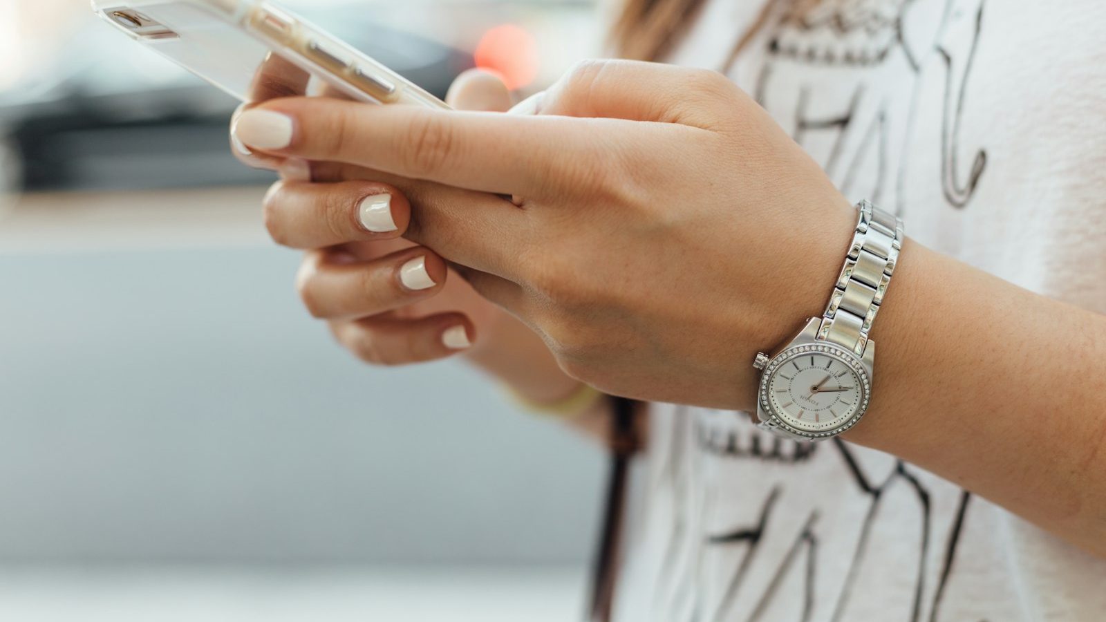A guest reading a restaurant text message offer on their phone