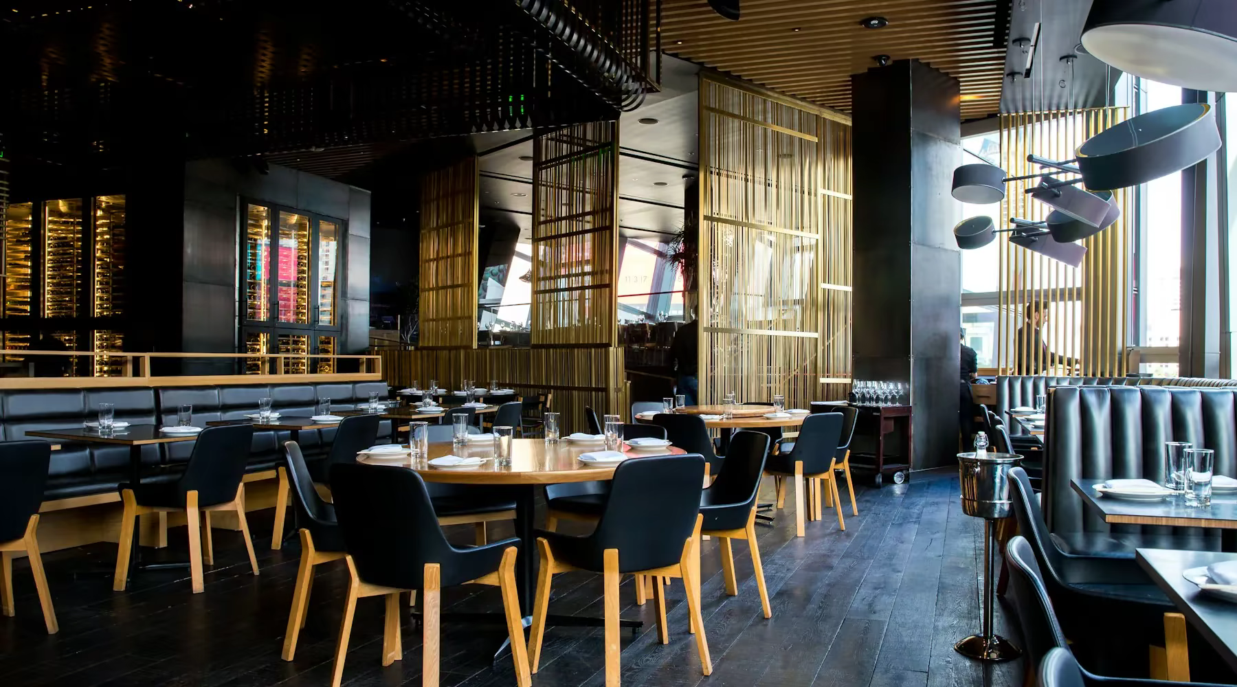 Dimly lit upscale restaurant interior with warm ambient lighting