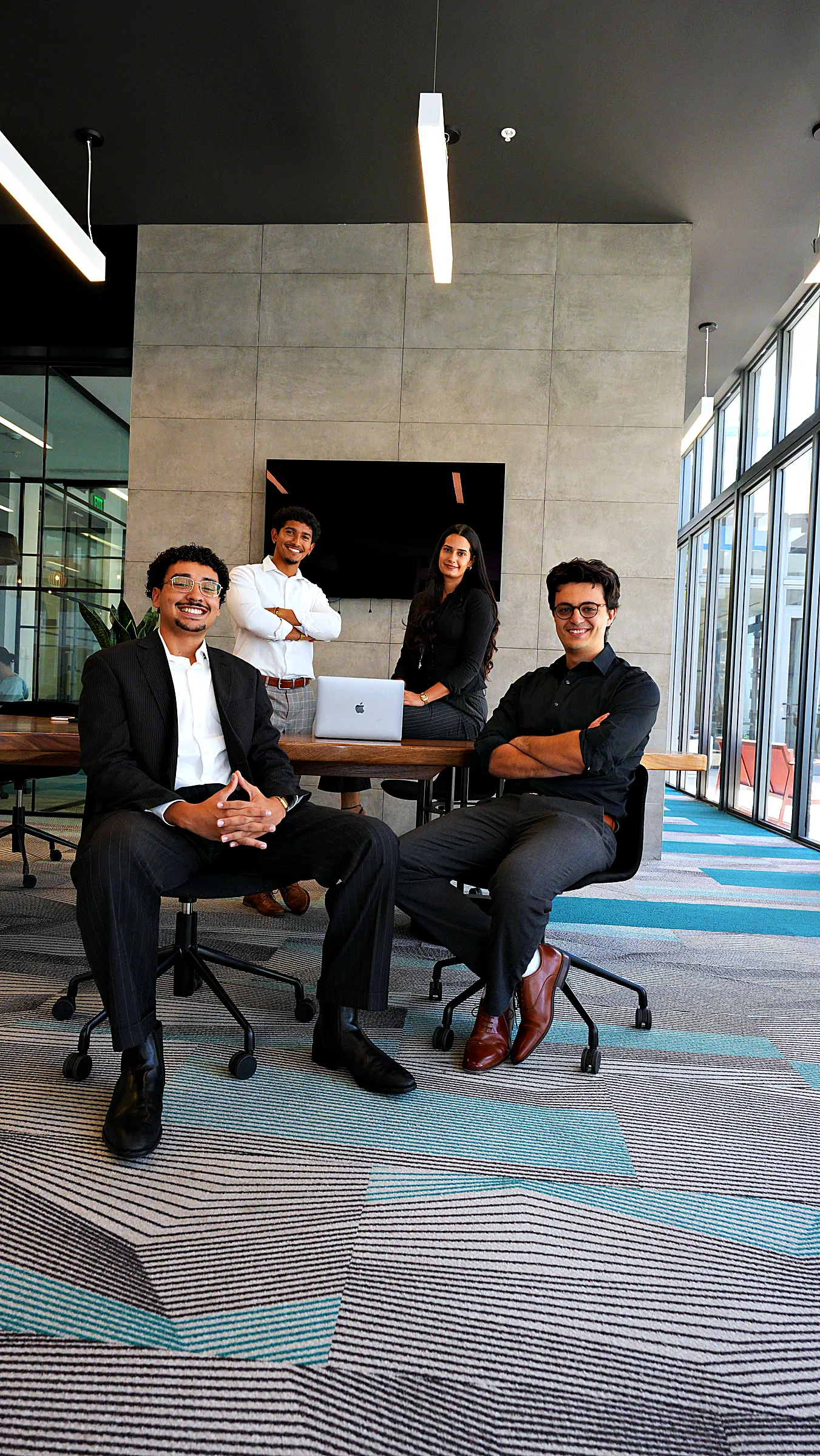 The Button Up Media team together at their Miami office